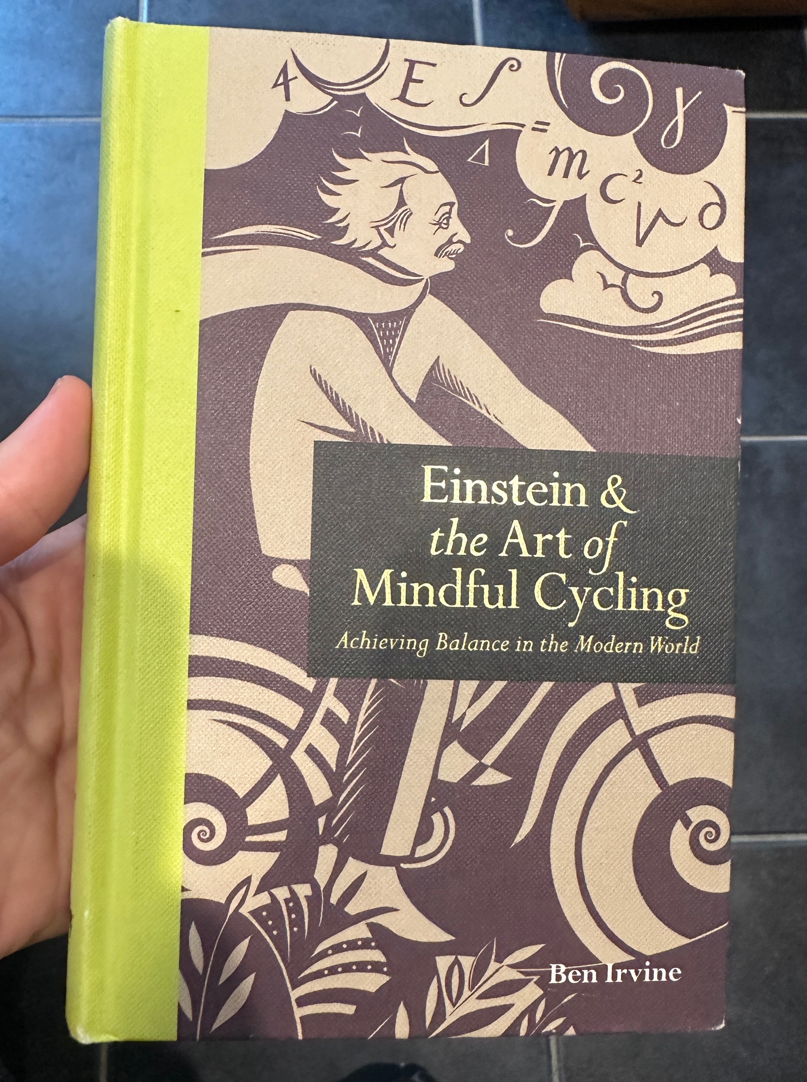A printed book about Albert Einstein, photographed on a desk.